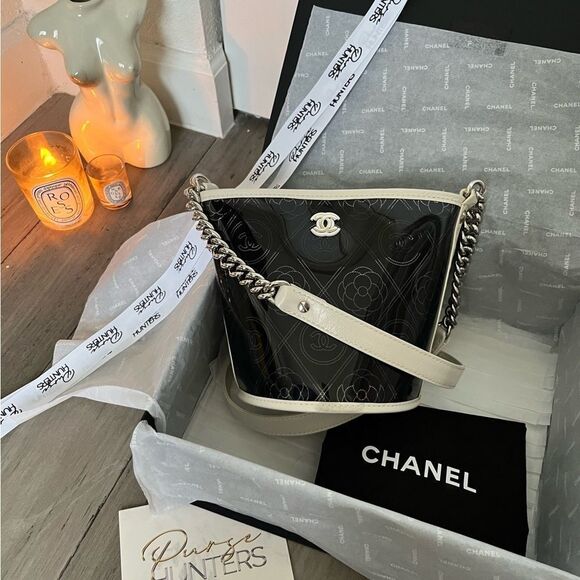 CHANEL Handbags - Chanel pvc bucket camellia bag small